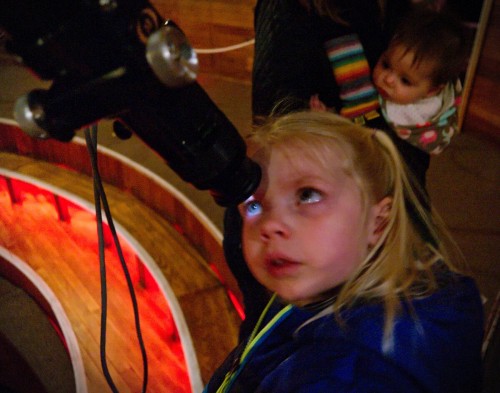 Moonlight hitting Heather's eye through the Clark Telescope at Lowell Observatory